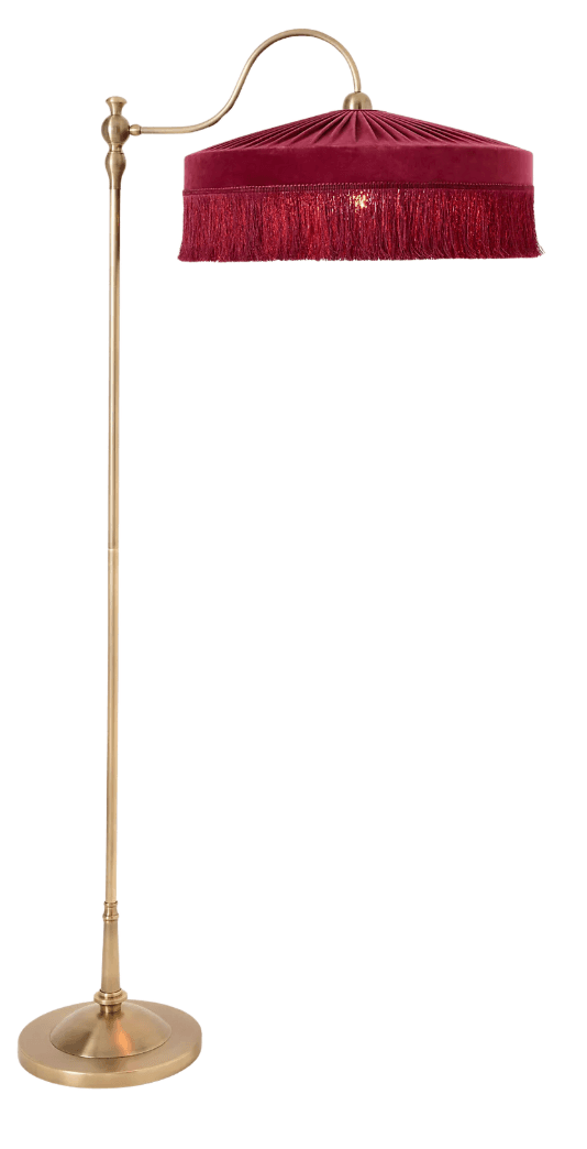 A vintage-inspired arc floor lamp featuring a polished brass finish and a distinctive fringed velvet shade in burgundy. The lamp has a slender, straight stand rising from a circular base, transitioning into a gracefully curved arm that suspends the dome-shaped light shade. The shade is characterized by radial pleats on its upper surface and an elaborate fringe trim along its lower edge. — 3D model