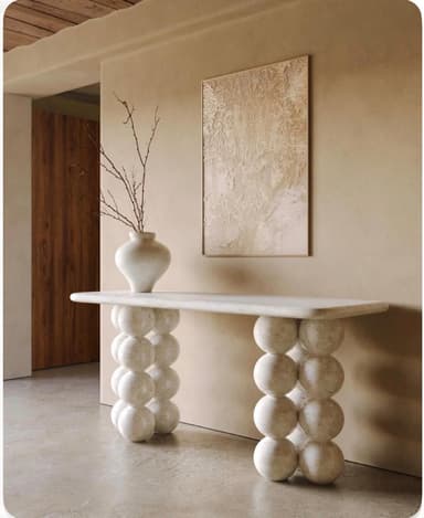 A white, rectangular bench featuring a solid top with rounded edges, supported by two bases each composed of three large, stacked spherical elements. The material appears to be a light-colored, textured stone or stone composite. — 3D model