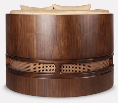 An elegant single-armed chaise lounge featuring a dark walnut wood frame with intricate cane webbing detail and plush upholstered cushions in a neutral beige fabric. — 3D model