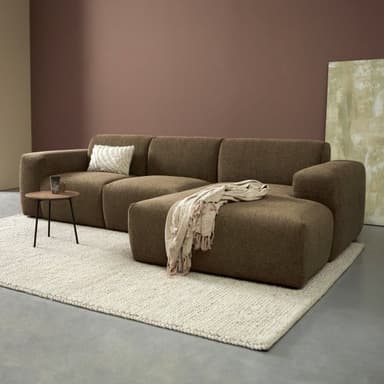 A contemporary modular sectional sofa featuring a chaise lounge, upholstered in a textured brown fabric. The design emphasizes rounded edges and a low profile, offering a comfortable and adaptable seating solution. — 3D model