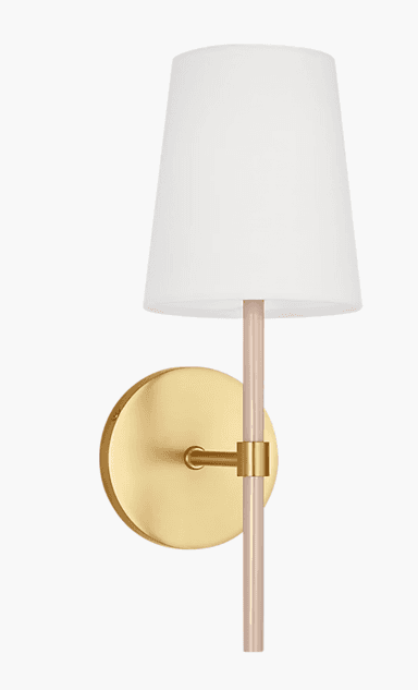 A modern wall sconce featuring a circular brass wall plate, an extending brass arm, and a vertical light-colored acrylic rod from which a white tapered fabric shade is suspended. The brass components have a brushed or satin finish, contributing to a contemporary aesthetic. — 3D model