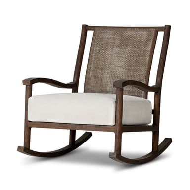 A rocking chair with a dark wood frame and woven cane back. The seat is upholstered in a white fabric. The chair has a classic rocking chair design with curved runners. — 3D model