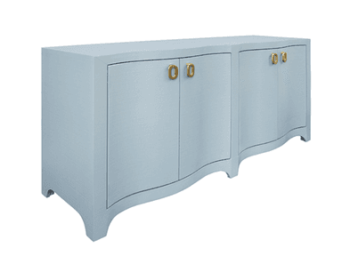 A light blue credenza featuring a textured, possibly faux shagreen, finish. It has four cabinet doors, each fitted with a distinct oval brass pull handle. The base of the credenza is characterized by a decorative scalloped design. — 3D model