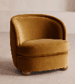 A modern, fully upholstered club armchair featuring a rounded backrest and integrated arms. The chair is covered in a plush, mustard yellow velvet-like fabric, providing a soft and inviting appearance. It has a compact silhouette with a deep, rounded seat cushion and is supported by four small, light-colored tapered wooden feet. — 3D model