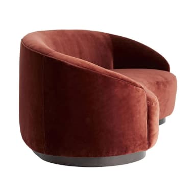 A curved sofa with a plush velvet upholstery in a deep reddish-brown hue. The sofa features a rounded silhouette with integrated armrests and a low-profile base. The base appears to be made of a darker material, possibly wood or metal, with a smooth finish and a slightly curved profile that mirrors the overall shape of the sofa. — 3D model