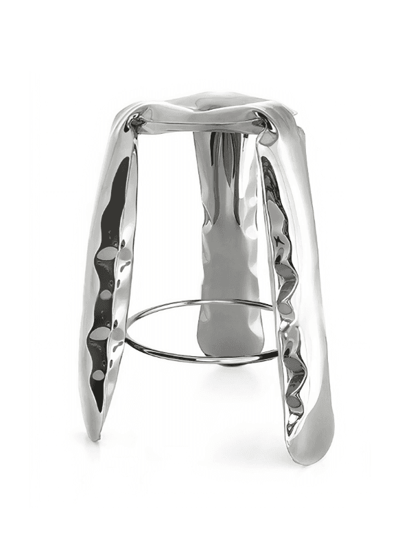 A modern, sculptural stool with a high-gloss metallic finish. The seat and legs have a fluid, irregular, and hammered appearance, suggesting a molten metal aesthetic. A circular metal ring connects the legs partway down, serving as a footrest. The stool is supported by four legs that taper slightly towards the base. — 3D model