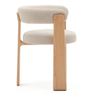 A modern armchair featuring a natural light wood frame and light beige upholstered seat and backrest. The backrest is a continuous, curved, padded form that extends into armrests, providing a minimalist and comfortable design. The seat is a round, upholstered cushion. The sturdy wooden legs are flat and integrated into the overall frame, suggesting a contemporary or Scandinavian aesthetic. — 3D model