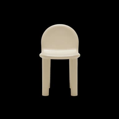 A minimalist, monolithic stool or small side table with a rounded, semicircular top and four integrated cylindrical legs, crafted from a light beige molded material. — 3D model