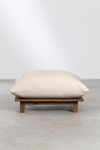 A low-profile ottoman with a wooden slatted base and a large, plush, cream-colored cushion. The base appears to be constructed from dark wood planks laid horizontally and supported by four short, block-style legs. The cushion is generously filled and contours to the base, suggesting a comfortable, oversized design. The overall aesthetic leans towards a relaxed, possibly outdoor or bohemian style. — 3D model