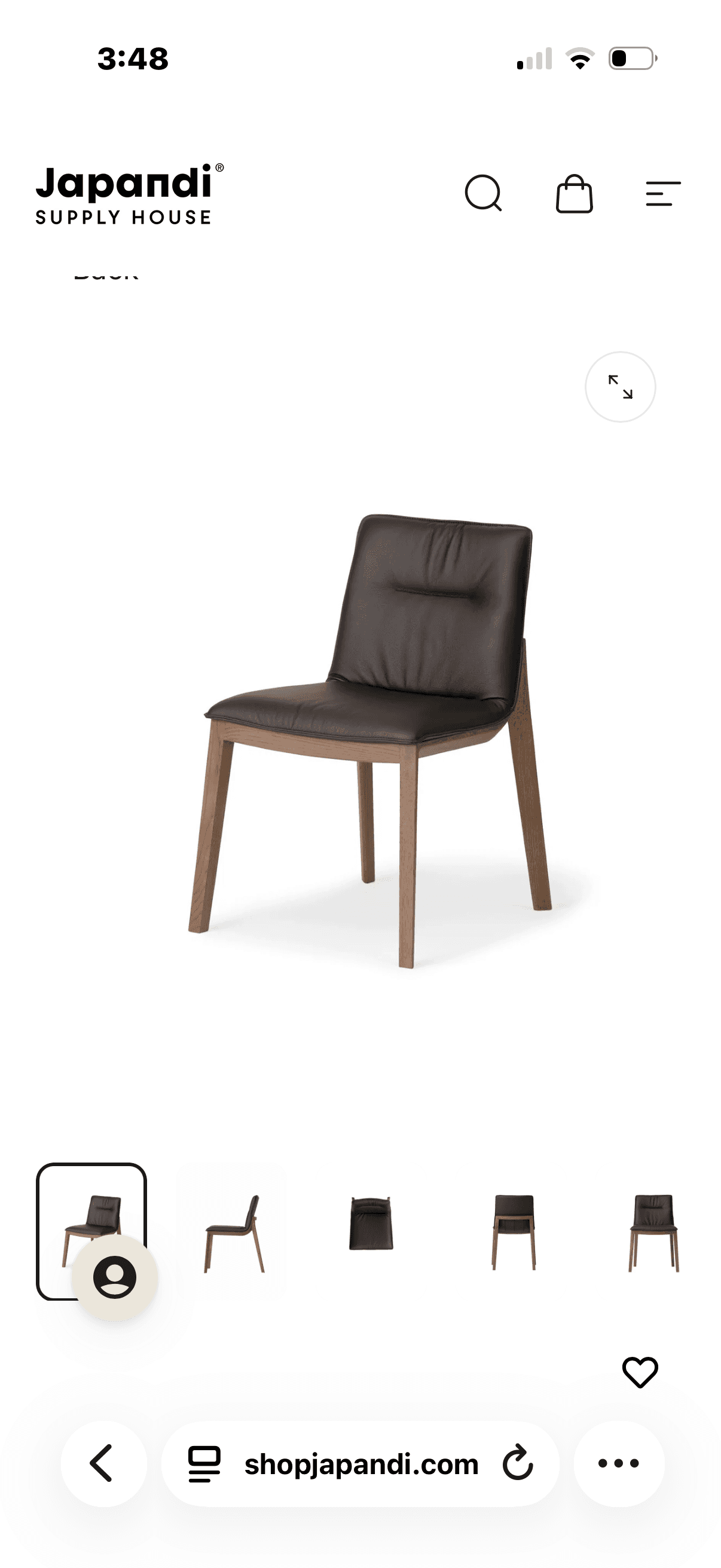 A contemporary armless dining chair featuring a solid wood frame with dark brown leather upholstery on the seat and backrest. The design is minimalist, with slightly tapered legs and a subtly curved back. — 3D model
