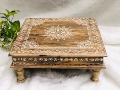 A low, square wooden accent table featuring intricate white mandala and border patterns on its top surface. It is supported by four turned, short legs. — 3D model