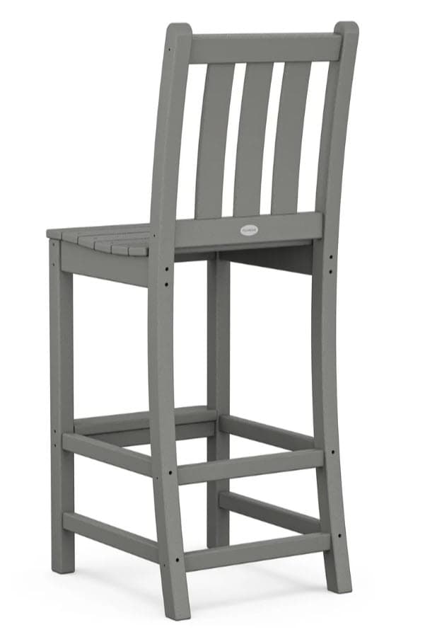 A grey bar stool with a slatted back and a plank-style seat. It features a four-legged design with a horizontal footrest connecting the legs. A small oval emblem is visible on the backrest. — 3D model