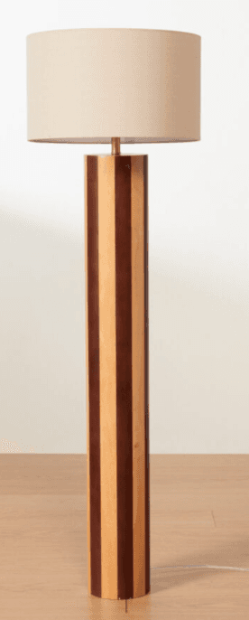 A floor lamp with a cylindrical base constructed from alternating strips of light and dark wood. The lamp features a conical shade in a neutral fabric color. — 3D model