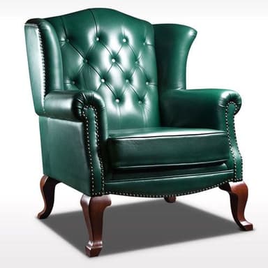 A classic wingback armchair upholstered in deep green leather, featuring extensive button tufting on the backrest, rolled arms, and decorative individual nailhead trim. The chair is supported by four dark wooden cabriole legs. — 3D model