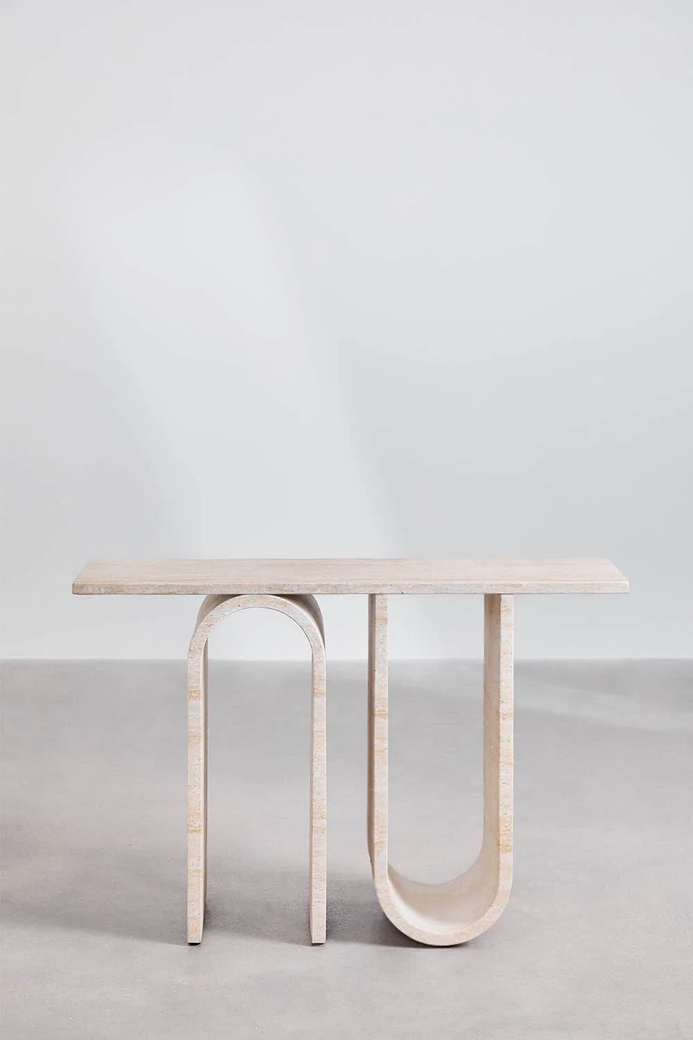 A console table with a rectangular top supported by two arched legs and one straight leg. The design features curved elements and a minimalist aesthetic. — 3D model