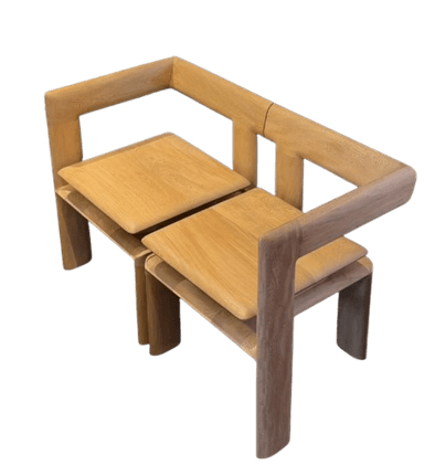 A modern minimalist loveseat constructed entirely from light-colored solid wood. It features a clean, rectilinear frame forming integrated back and armrests, with two individual, slightly curved wooden seat panels. — 3D model