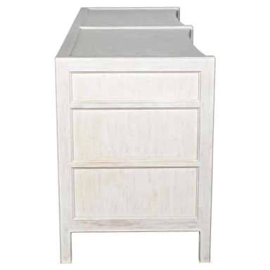 A low, horizontal dresser with two columns of drawers. The left column has three drawers, and the right column also has three drawers. All drawers have simple, dark, circular knobs. The dresser has a slightly curved apron at the bottom. — 3D model