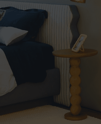 A minimalist, contemporary accent table crafted from natural light-toned wood. It features a round tabletop supported by a distinctive central pedestal column composed of five stacked spherical or 'beaded' segments, resting on a round, flat base. — 3D model
