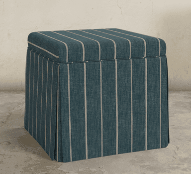A square, upholstered ottoman featuring a pleated skirt that extends to the floor. The fabric is a dark teal with thin, light-colored vertical stripes. The top cushion is slightly rounded at the edges. — 3D model
