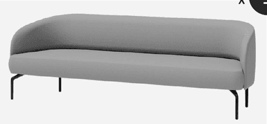A contemporary sofa featuring a sleek, minimalist design with light gray fabric upholstery. It has an asymmetrical form with a backrest that curves smoothly into an integrated armrest on one side, while the other side is armless. The sofa is supported by slender, angled black metal legs, giving it a modern and airy appearance. — 3D model