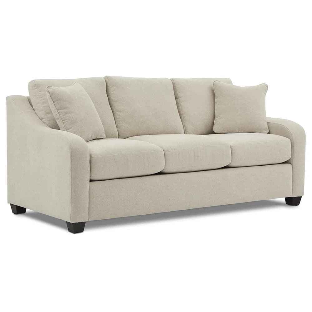 A three-seater sofa with plush cushions and a light-colored fabric upholstery. The sofa features a modern design with rolled arms and is supported by short, dark legs. Two throw pillows are visible, one at each end of the sofa. — 3D model