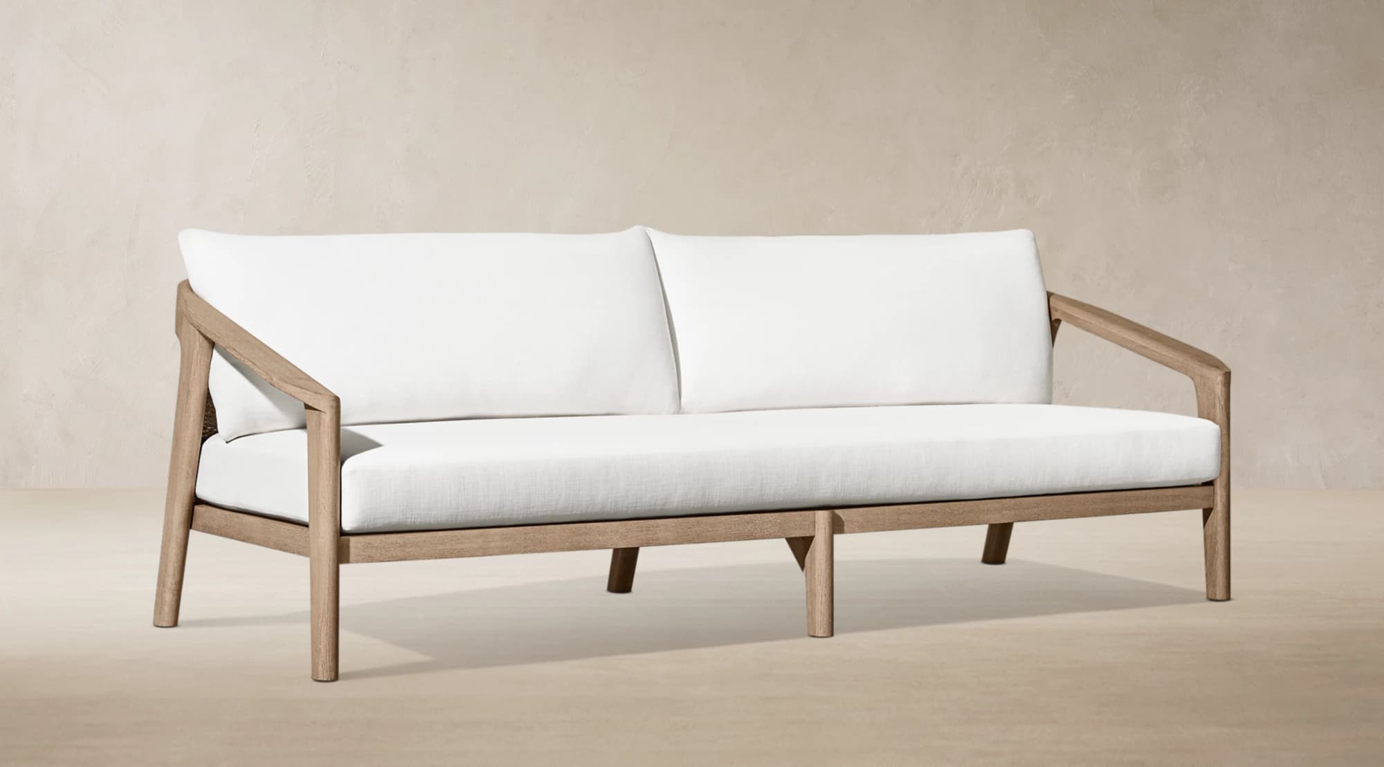 A modern outdoor two-seater sofa featuring a sturdy, light-toned wooden frame and plush white upholstered cushions for both seat and back. — 3D model