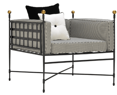 A bench with a dark metal frame and a cushioned seat upholstered in a black and white houndstooth pattern fabric. The backrest is also upholstered with the same fabric and features a grid-like design formed by dark straps. Two spherical finials are visible at the top of the backrest on the left side. — 3D model