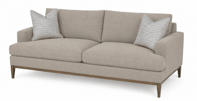 A two-seater sofa with a neutral beige fabric upholstery. It features two throw pillows with a black and white geometric pattern. The sofa has a low-profile design with a visible wooden base and tapered legs, suggesting a modern or mid-century modern style. — 3D model