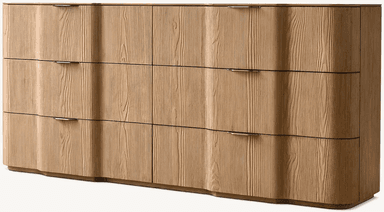 A wide, contemporary dresser featuring a distinctive wavy facade made from light-colored ash wood with a prominent grain. It includes multiple drawers and doors, each fitted with a sleek, recessed metal pull. — 3D model