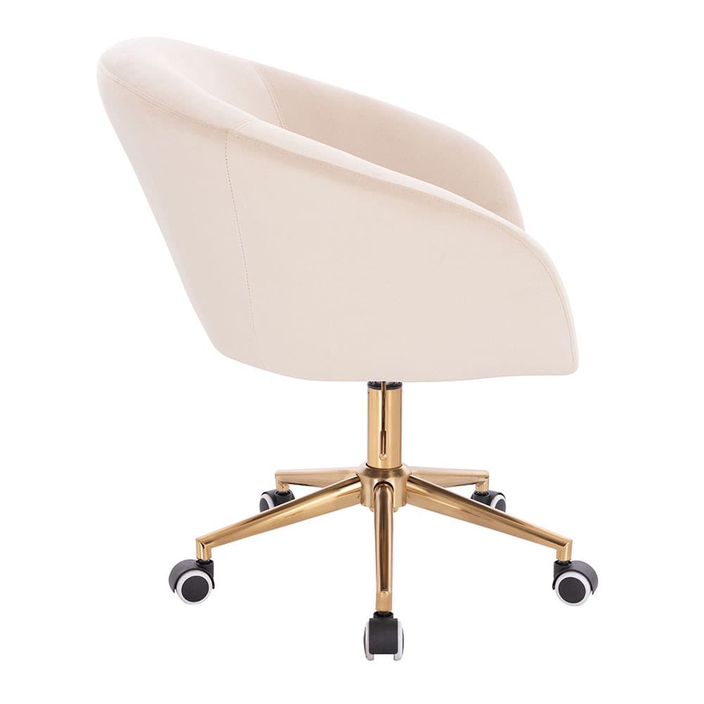 A cream-colored velvet desk chair with a curved backrest and armrests. It features a gold-tone metal base with five legs, each equipped with a caster wheel for mobility. The chair has a central gas lift mechanism for height adjustment. — 3D model