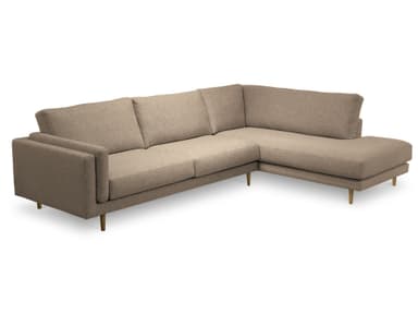 A sectional sofa with a light beige fabric upholstery and slender gold-toned legs. The sofa features a modular design with multiple seating sections, including a chaise lounge extension on the right. The back cushions are slightly curved, and the armrests are squared. The overall aesthetic is modern and minimalist. — 3D model
