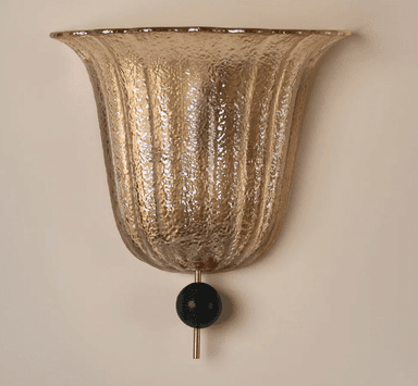 A bell-shaped lighting fixture or shade featuring textured, vertically fluted amber-toned glass, accented at the bottom with a slender brass rod and a black spherical marble finial. — 3D model
