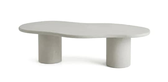 A light-toned, modern coffee table featuring an irregularly shaped top and two robust cylindrical legs, likely made from a plaster or concrete composite. — 3D model