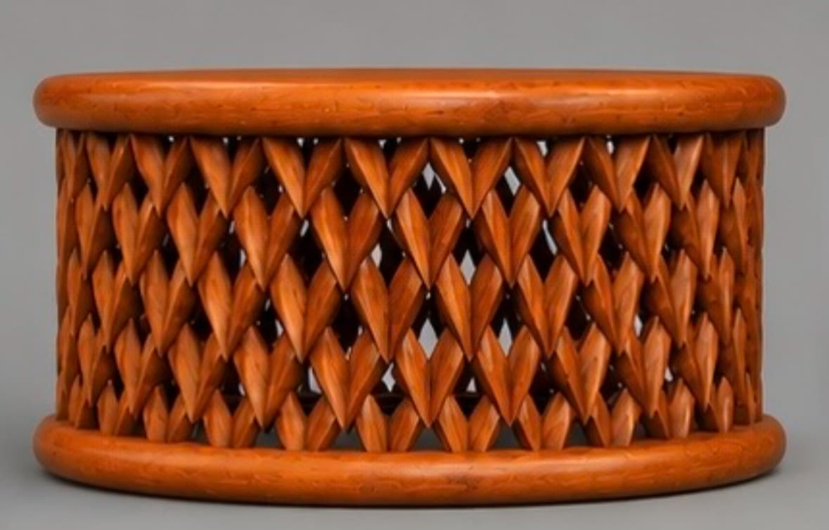 A small, cylindrical wooden table featuring a unique, intricately carved side panel. The top and bottom rims are smooth and rounded, providing a polished frame for the main body. The central section is composed of numerous interlocking, heart-shaped or pointed leaf-like wooden pieces, arranged in an open-work lattice pattern. The wood exhibits a warm, medium brown tone with visible grain, suggesting a natural finish. The design creates visual texture and allows light to pass through, contributing to its decorative appeal. — 3D model