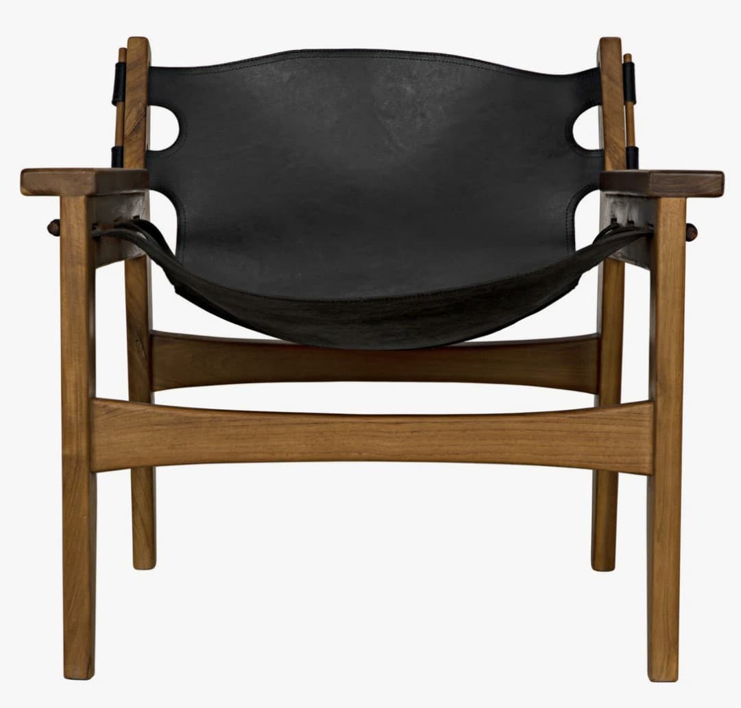 A low-slung lounge chair with a wooden frame and a black leather seat and backrest. The frame features a horizontal stretcher between the front legs and a similar stretcher connecting the rear legs. The backrest is a single piece of black leather with cut-out details on the sides, supported by wooden uprights. The seat is also made of black leather, suspended from the wooden frame and appearing to have a slight curve. The armrests are integrated into the wooden frame. — 3D model