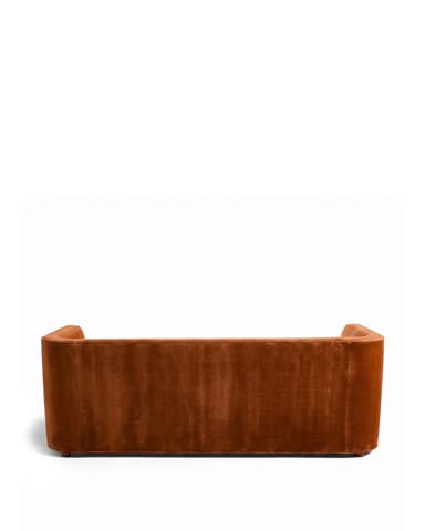 A contemporary three-seater sofa with a sleek, minimalist design. It features a low-profile frame with integrated arms that extend to the front, creating a cohesive look. The upholstery appears to be a soft, plush fabric with a matte finish, and the seat and back cushions are well-defined. The sofa sits on block-style legs integrated into the frame. — 3D model
