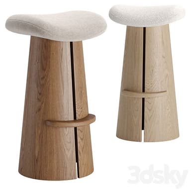 A modern bar stool featuring a tapered wooden base and an upholstered saddle-shaped seat. The base appears to be constructed from multiple vertical wooden slats or panels, creating a subtly textured and robust foundation. An integrated, curved wooden footrest is positioned on one side of the base. The seat is covered in a light, textured fabric, complementing the natural wood tone. — 3D model