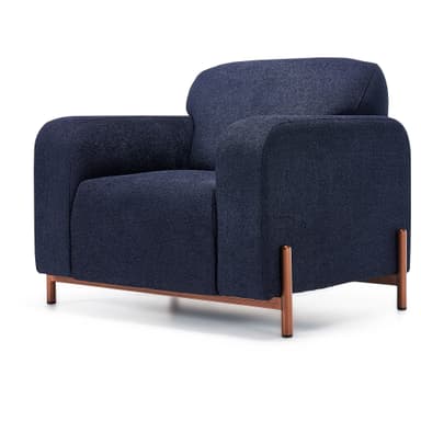 A contemporary upholstered armchair featuring a dark blue textured fabric. The chair has a boxy silhouette with gently rounded corners and integrated armrests. It is supported by a distinctive exposed metal base with an antique copper or bronze finish, which extends into four vertical legs. — 3D model