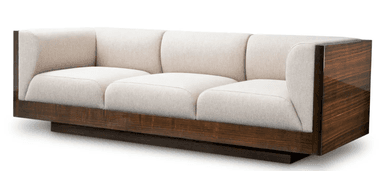 A three-seater modern sofa featuring a substantial exposed dark wood frame that encompasses the base and extends upwards to form the outer armrests. The interior seating area consists of three individual seat cushions and three individual back cushions, all upholstered in a light-colored, possibly cream or off-white, fabric. The wood components exhibit a glossy, rich dark brown finish with prominent grain patterns, suggesting a high-quality veneer. The sofa sits on a low, recessed plinth base, giving it a floating appearance. — 3D model