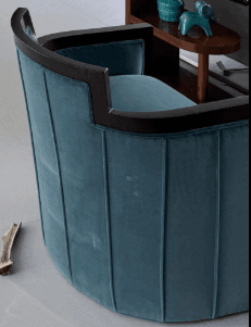 A pair of teal velvet upholstered club chairs with a dark exposed wooden frame, featuring a curved barrel back design and vertical channel tufting on the exterior. — 3D model