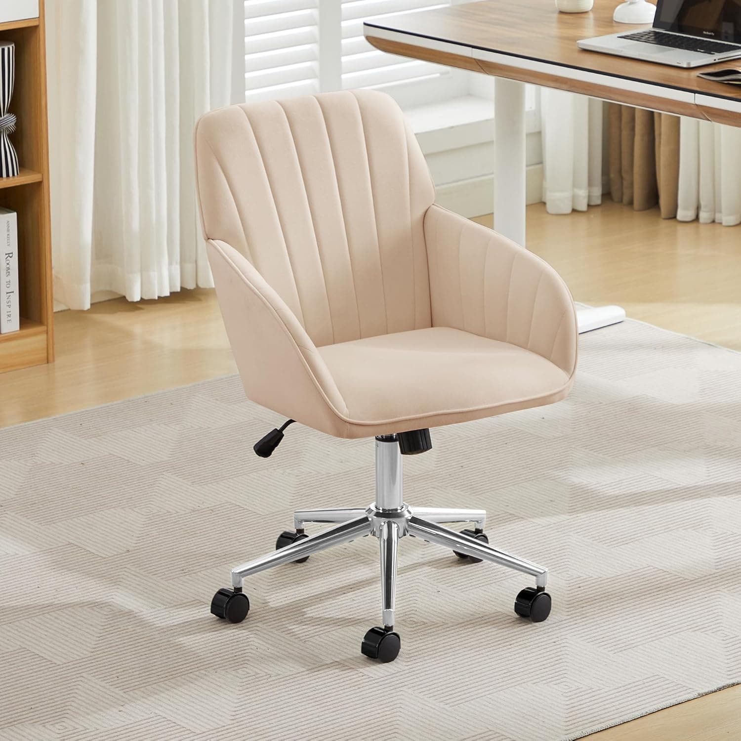 A cream-colored, upholstered office chair with a tufted backrest and integrated armrests. It features a five-star chrome base with black casters for mobility and an adjustable height mechanism. — 3D model