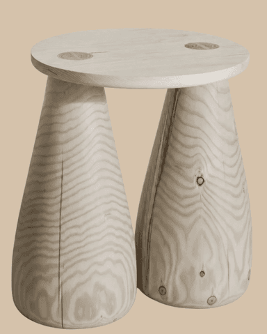 A modern sculptural stool made from light-toned wood, featuring a round top surface supported by two distinct conical legs. The wood has a visible, natural grain with knots. — 3D model