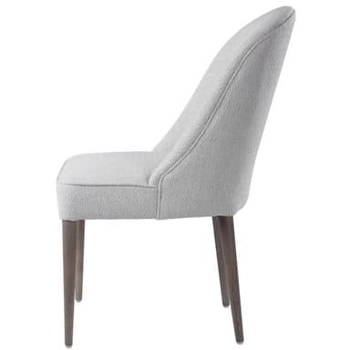 An armless upholstered dining chair featuring a gracefully curved high backrest and a fully cushioned seat, both covered in a light gray textured fabric. The chair is supported by four slender, tapered wooden legs with a dark, possibly walnut or espresso, finish. Its minimalist design and neutral color palette suggest a contemporary or transitional aesthetic. — 3D model