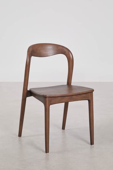 A contemporary dining chair crafted from dark wood, featuring a gracefully curved backrest that seamlessly transitions into the rear legs. The seat is flat and slightly rounded at the edges, supported by four tapered legs. The overall design emphasizes smooth lines and a minimalist aesthetic. — 3D model