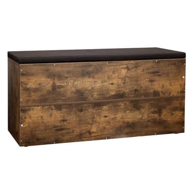 A rectangular storage bench featuring a distressed wood-look finish, multiple open cubby compartments for storage, and a dark, padded fabric cushion on top for seating. The unit is designed for functional organization and provides a rustic aesthetic. — 3D model