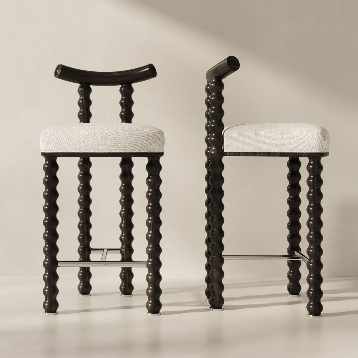 A bar stool with a dark wood frame and a light-colored upholstered seat. The frame features turned wooden legs with a series of rounded protrusions, giving it a distinctive bobbin or spindle design. The backrest is curved and made of the same dark wood. A metal footrest connects the front legs. — 3D model