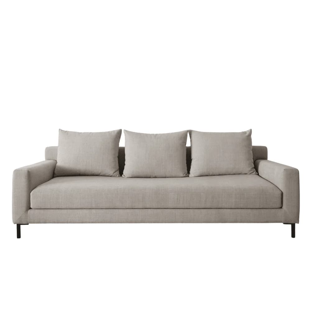 A three-seater sofa with a modern design, featuring a rectangular silhouette, plush seat cushions, and three loose back cushions. The sofa is upholstered in a light gray, textured fabric and is supported by thin, black, angled legs. — 3D model