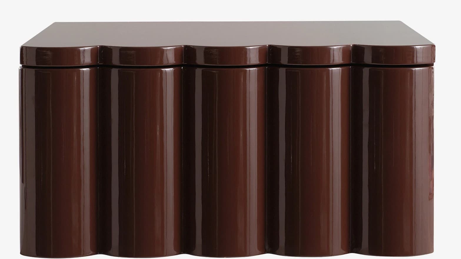 A brown cabinet with a high-gloss finish. The front features a scalloped design with vertical, rounded panels. The top surface is flat and extends slightly beyond the main body. — 3D model