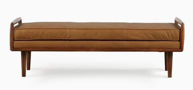 A mid-century modern upholstered bench featuring a solid wood frame with integrated armrests and four tapered legs. The seat is covered in brown leather upholstery. — 3D model
