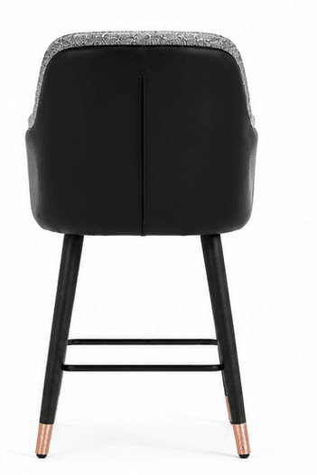 A tall, upholstered bar stool featuring a contoured seat and backrest with integrated armrests, covered in a gray and white patterned fabric. It stands on four tapered black legs with copper-finished feet and includes a black metal footrest. — 3D model